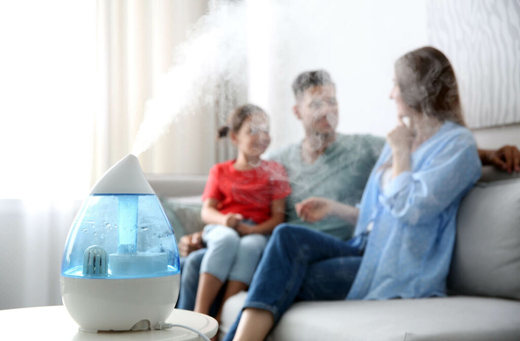 A close-up of a  humidifier operating and placed on top of a table in the living room to increase moisture in the air.