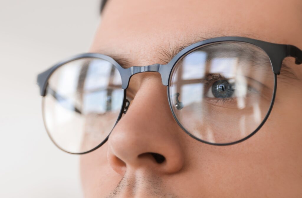 A close-up of a person with myopia wearing glasses to correct their vision.